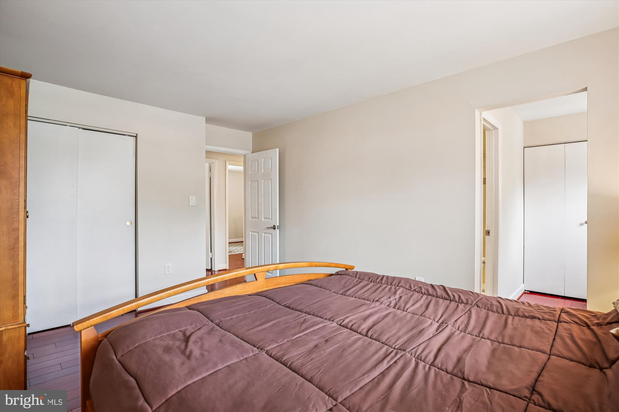 2702 Atlanta Drive, Unit 72702 Silver Spring, MD 20906 - Photo 26 of 55 a bedroom with a bed and painting on the wall