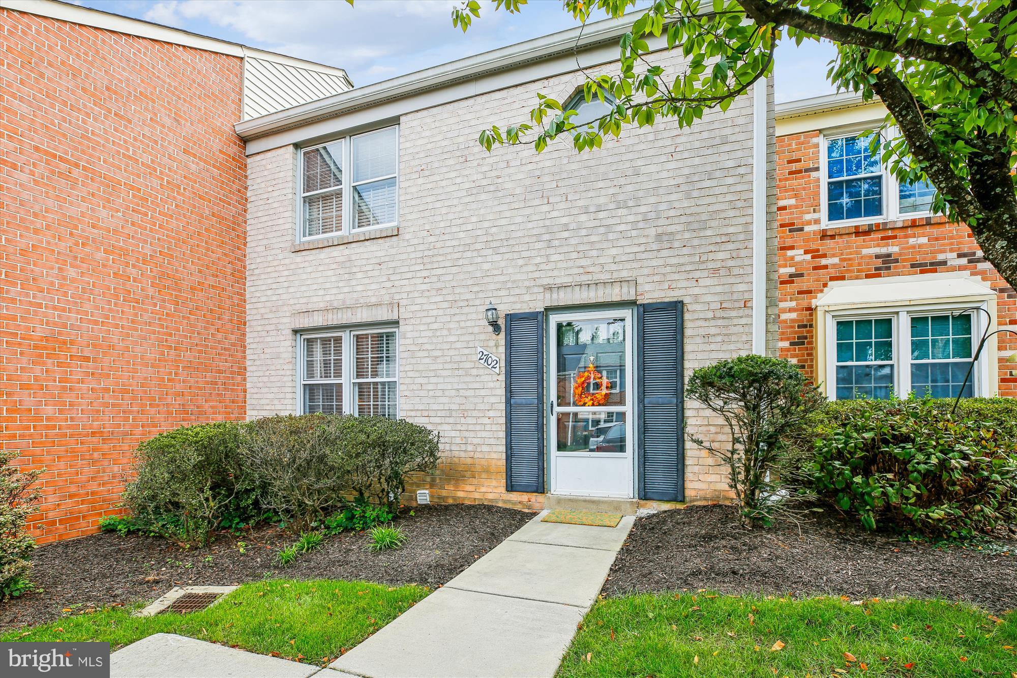 2702 Atlanta Drive, Unit 72702 Silver Spring, MD 20906 - Photo 3 of 55 a front view of a house with a yard