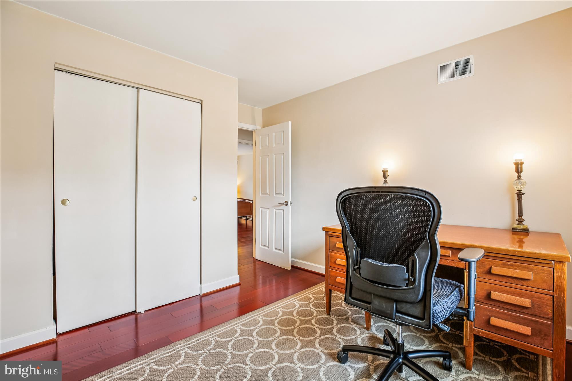 2702 Atlanta Drive, Unit 72702 Silver Spring, MD 20906 - Photo 32 of 55 a chair and a table in a room