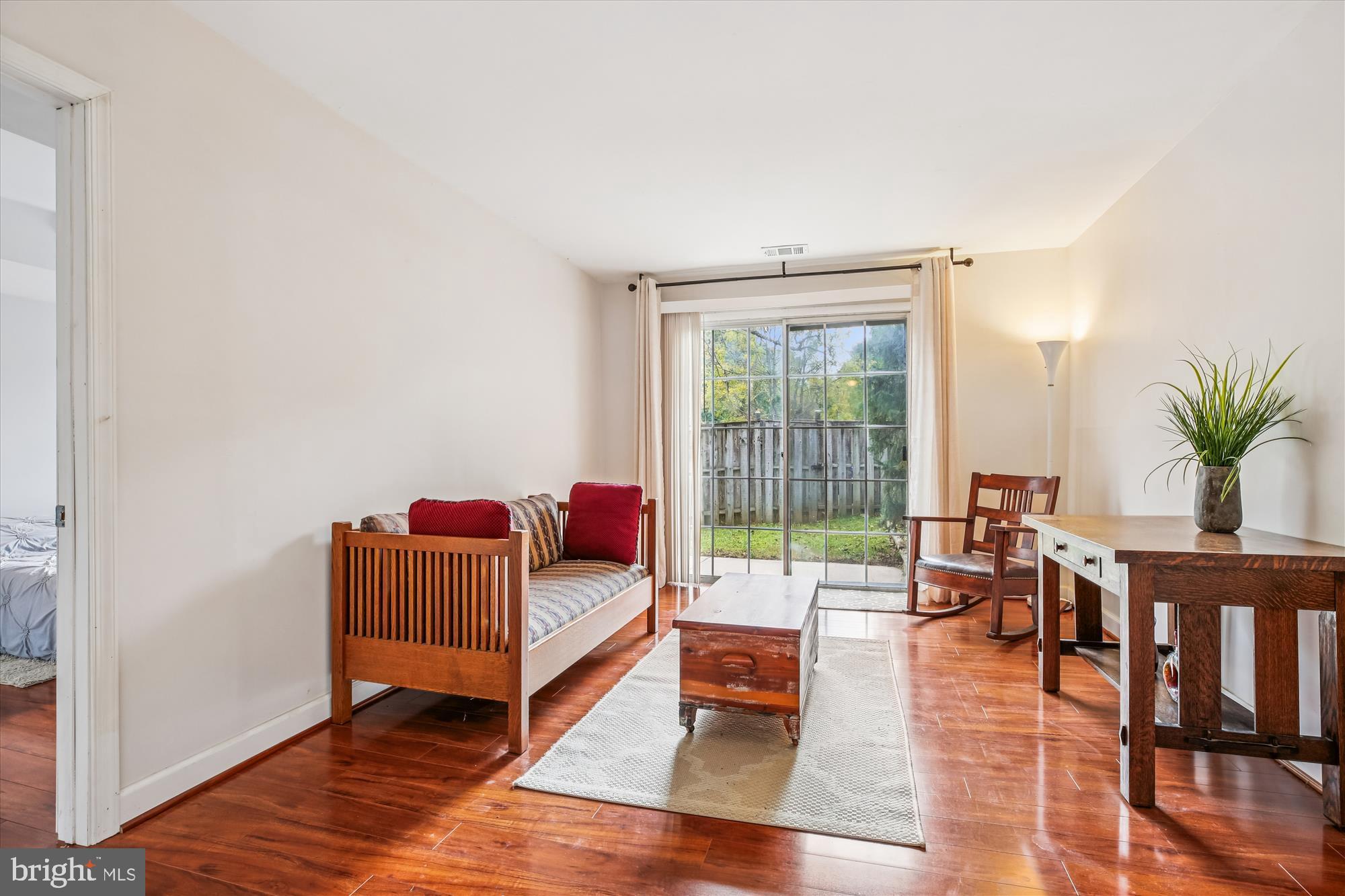 2702 Atlanta Drive, Unit 72702 Silver Spring, MD 20906 - Photo 37 of 55 a living room with furniture and wooden floor