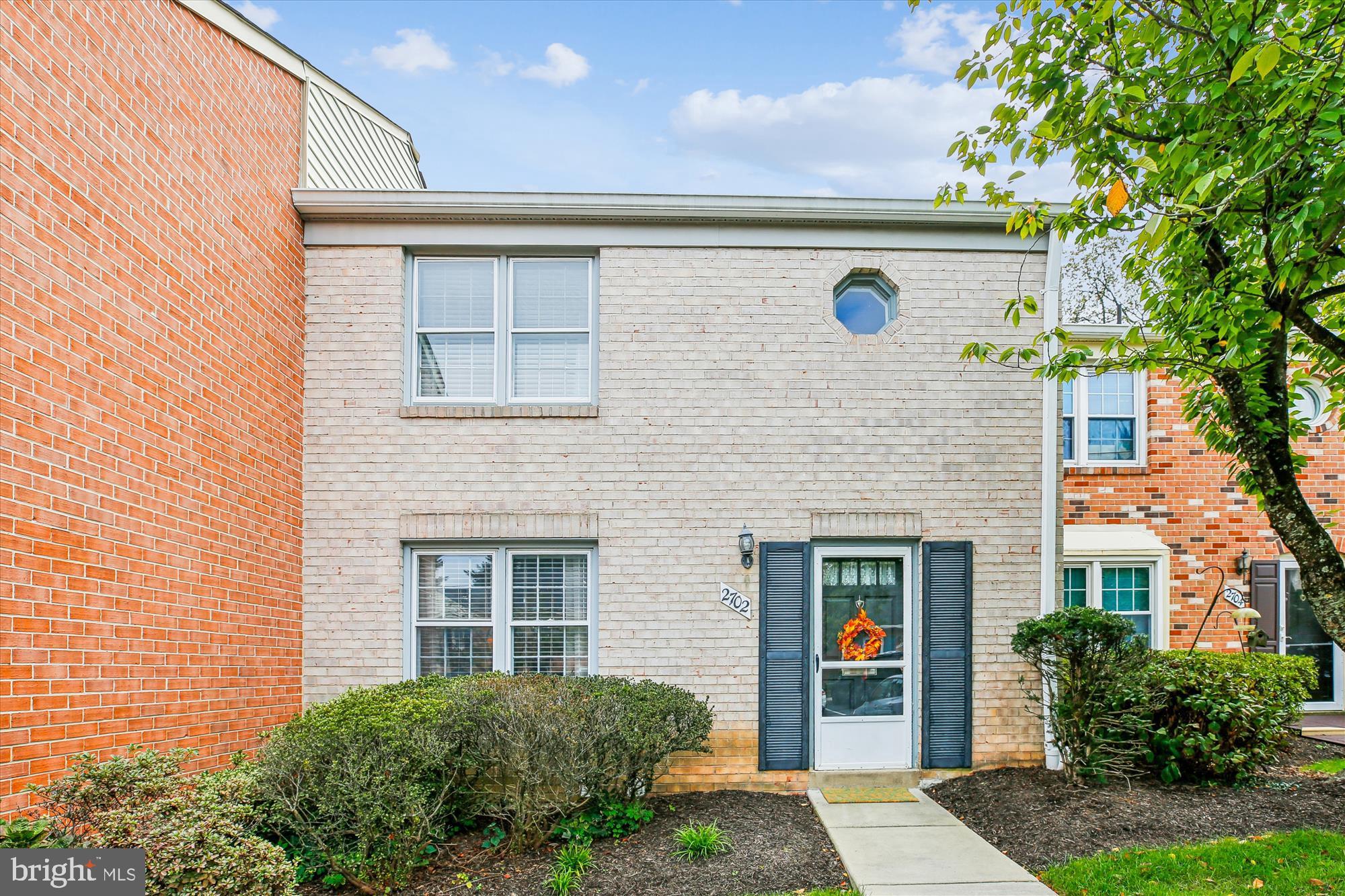 2702 Atlanta Drive, Unit 72702 Silver Spring, MD 20906 - Photo 4 of 55 a front view of a house with a garden