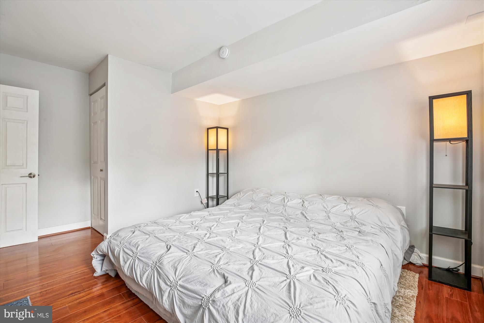 2702 Atlanta Drive, Unit 72702 Silver Spring, MD 20906 - Photo 42 of 55 a bedroom with a bed and wooden floor