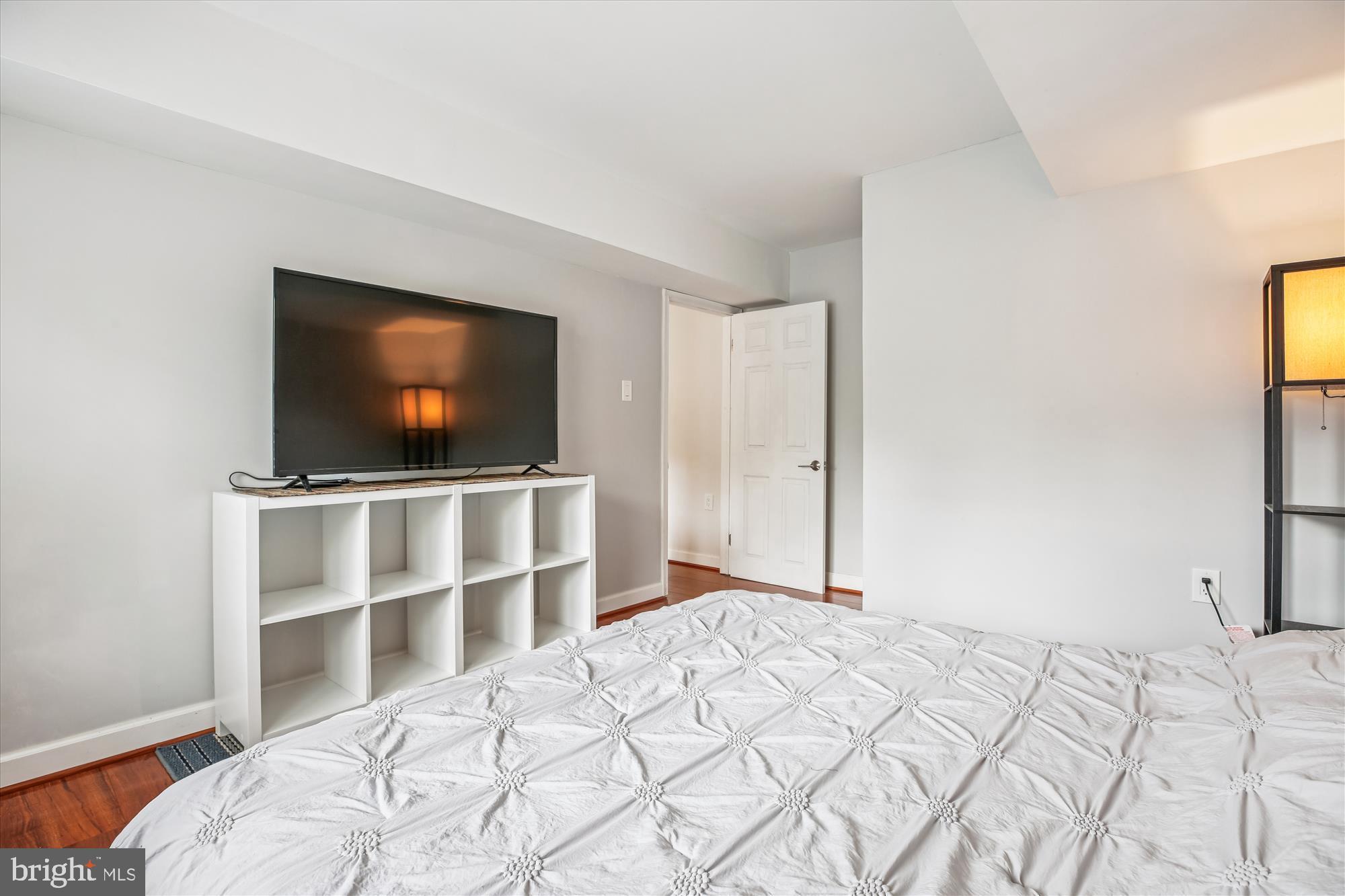 2702 Atlanta Drive, Unit 72702 Silver Spring, MD 20906 - Photo 43 of 55 a bedroom with a flat screen tv and a bed