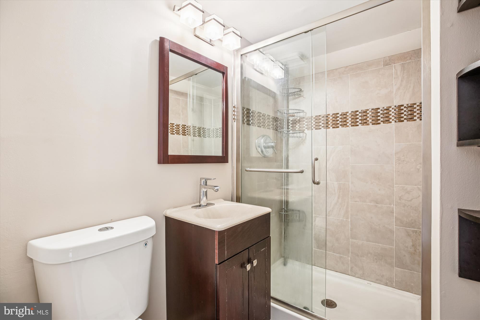 2702 Atlanta Drive, Unit 72702 Silver Spring, MD 20906 - Photo 44 of 55 a bathroom with a sink a toilet and shower