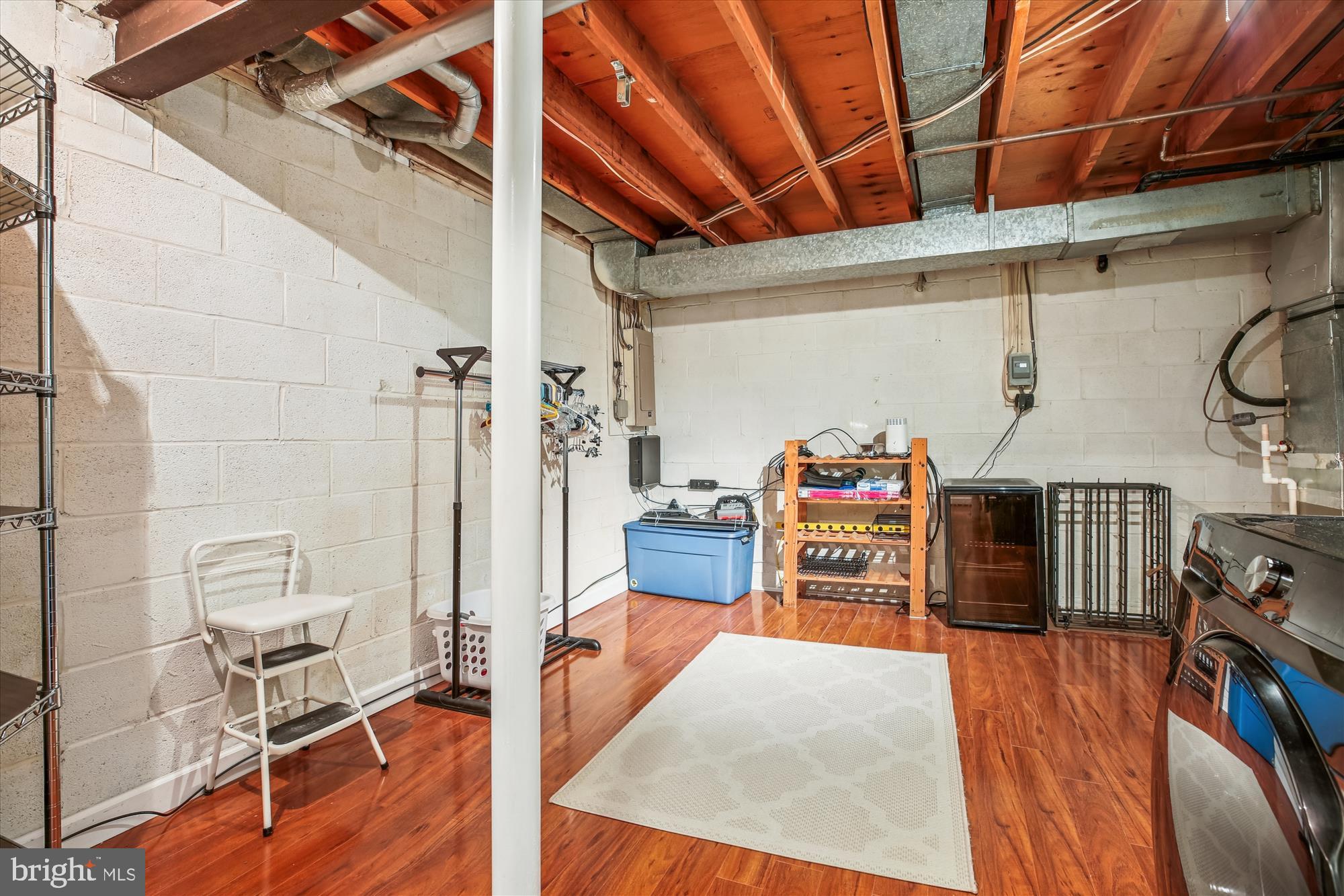 2702 Atlanta Drive, Unit 72702 Silver Spring, MD 20906 - Photo 47 of 55 a bedroom with furniture and a wooden floor