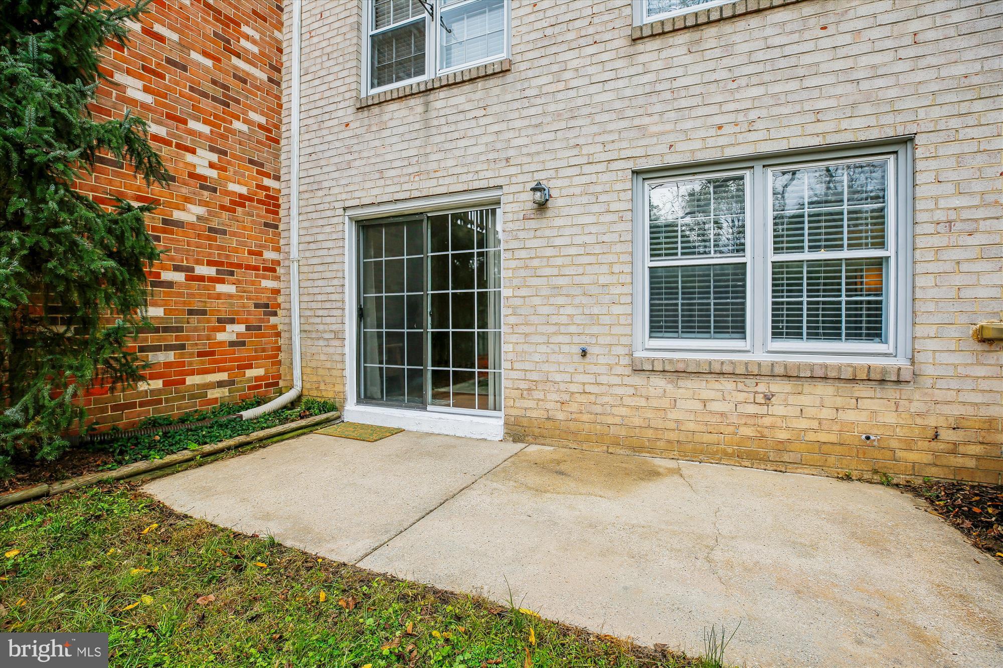 2702 Atlanta Drive, Unit 72702 Silver Spring, MD 20906 - Photo 49 of 55 a front view of a house with a yard