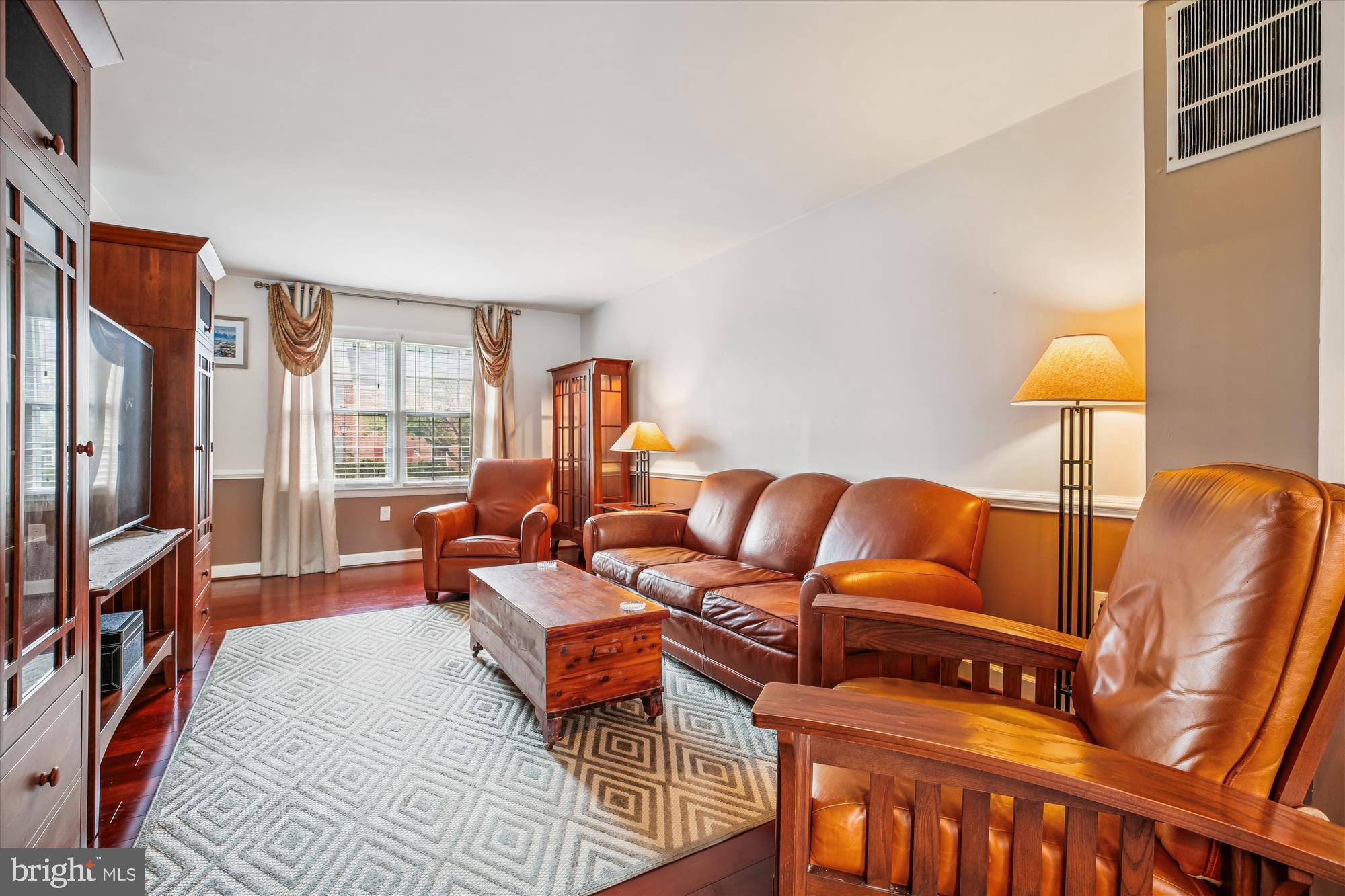 2702 Atlanta Drive, Unit 72702 Silver Spring, MD 20906 - Photo 8 of 55 a living room with furniture and a lamp