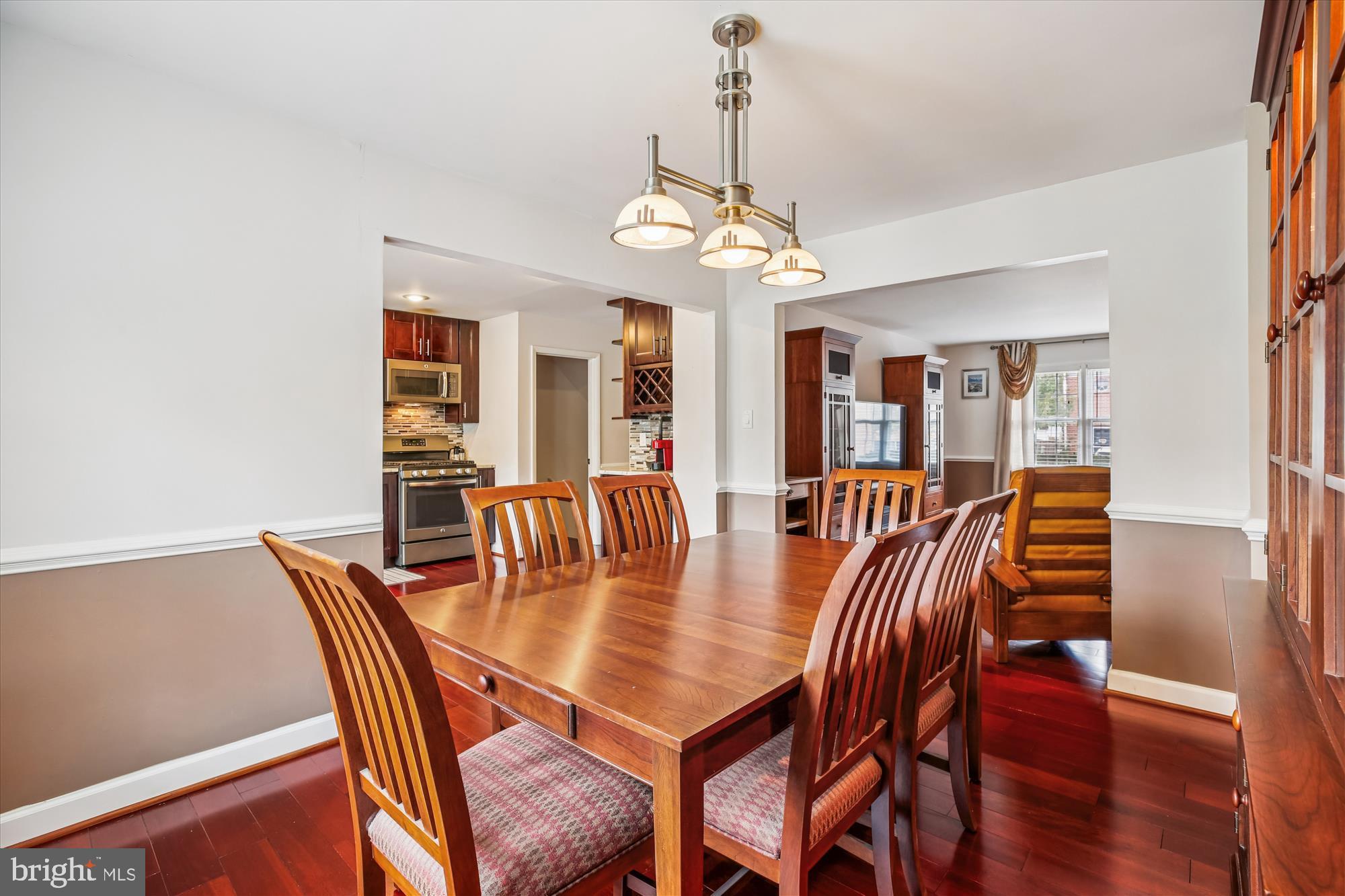 2702 Atlanta Drive, Unit 72702 Silver Spring, MD 20906 - Photo 10 of 55 a dining room with furniture a chandelier and wooden floor