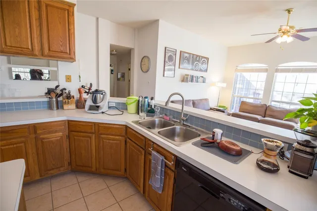 a kitchen with a sink and cabinets