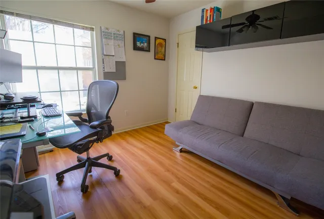 a bedroom with a workspace