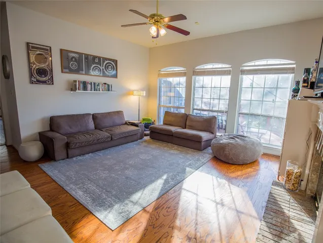 a living room with furniture and a rug