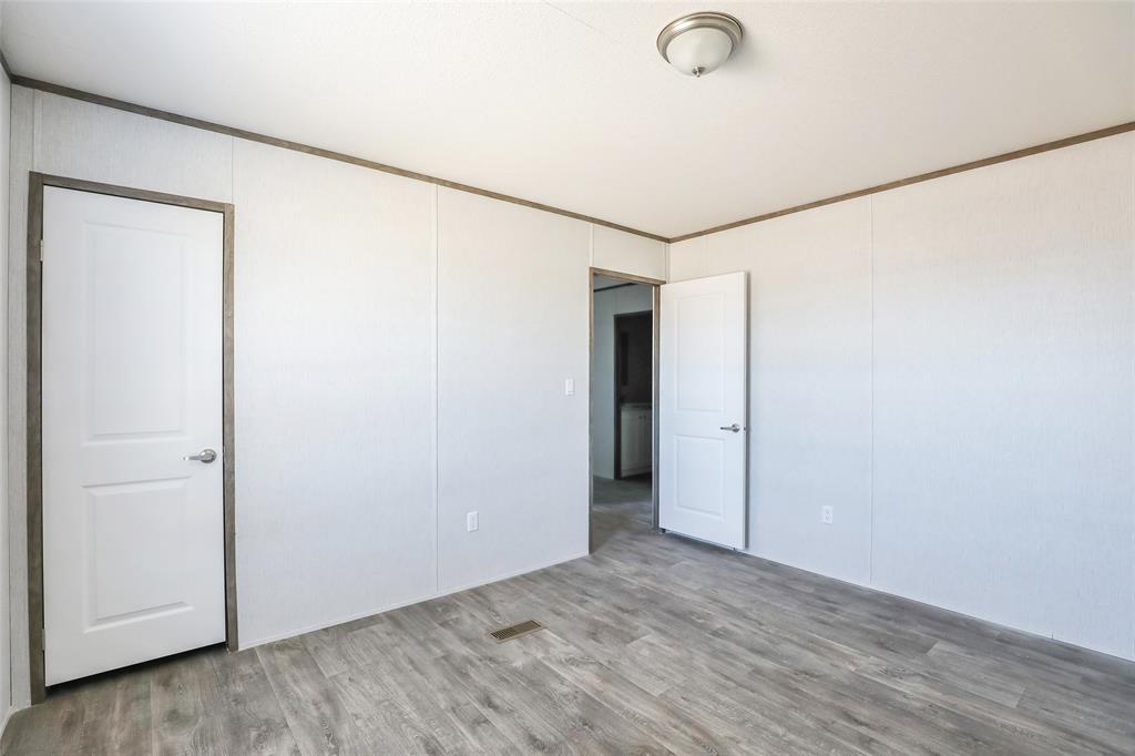420 Haynes Street Merkel, TX 79536 - Photo 21 of 27 a view of a room with wooden floor