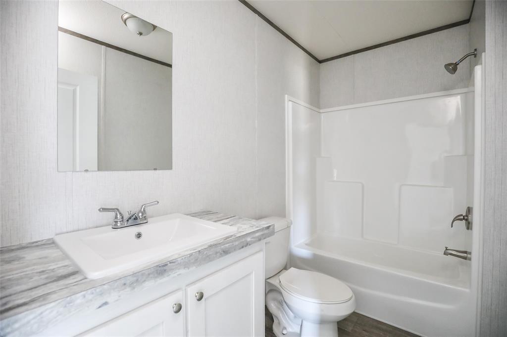 420 Haynes Street Merkel, TX 79536 - Photo 25 of 27 a bathroom with a sink toilet and shower