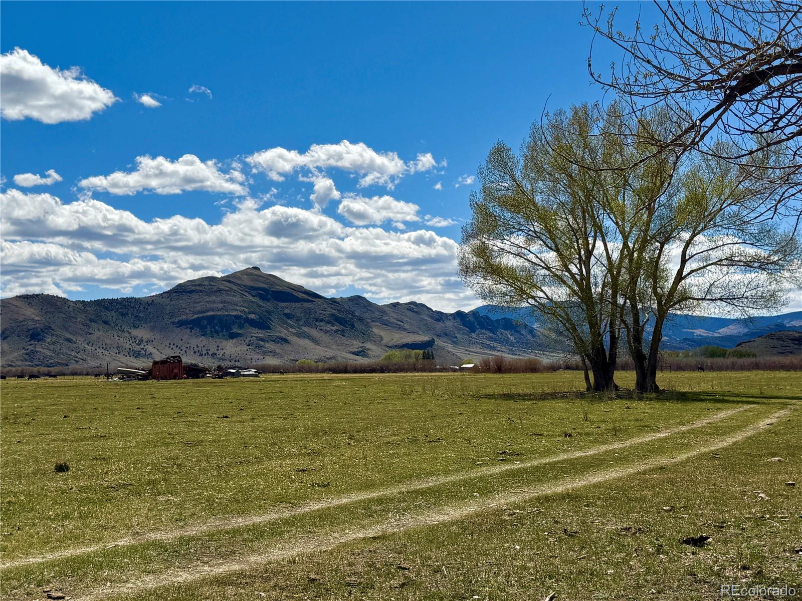 Hazard Ranch Saguache, CO 81149 - Photo 2 of 16 a view of a lake with a mountain in the background