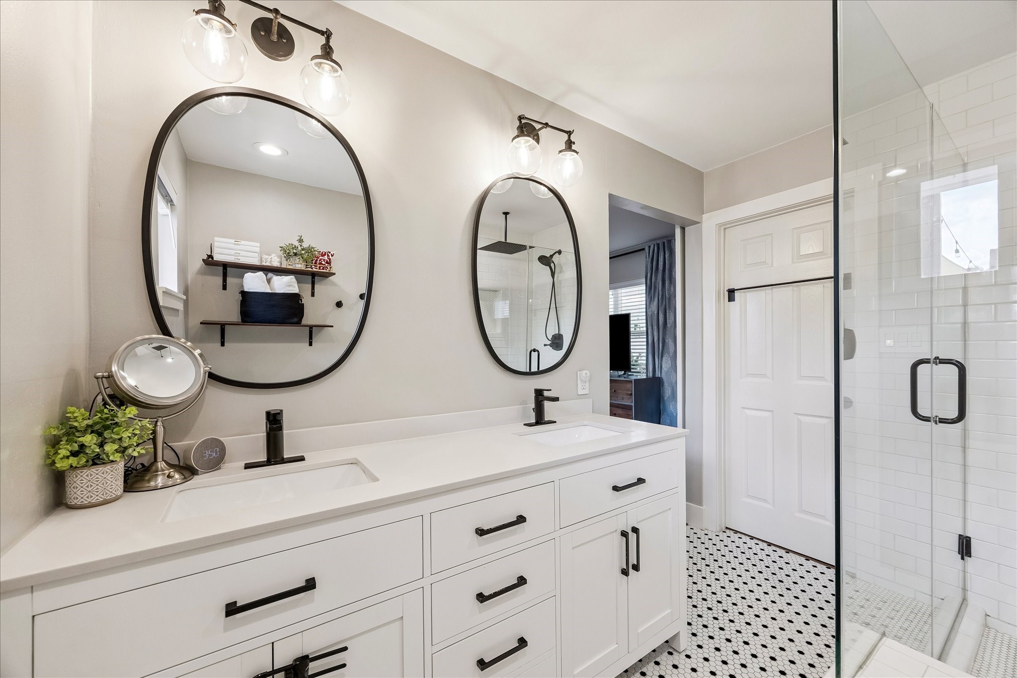 2203 Lamonte Lane Houston, TX 77018 - Photo 14 of 25 a bathroom with a double vanity sink and a mirror