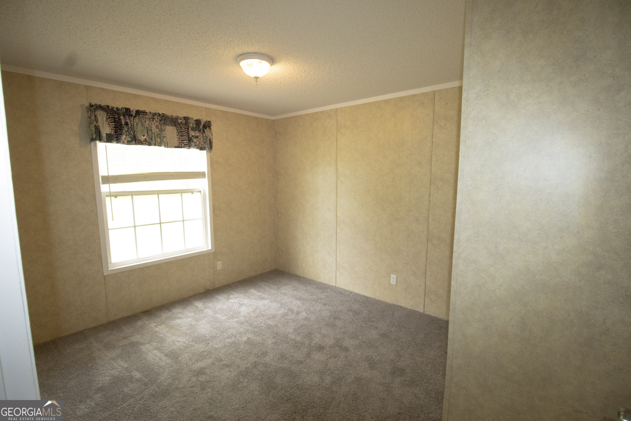 1776 Zettwell Road Statesboro, GA 30461 - Photo 12 of 20 a view of an empty room with a window