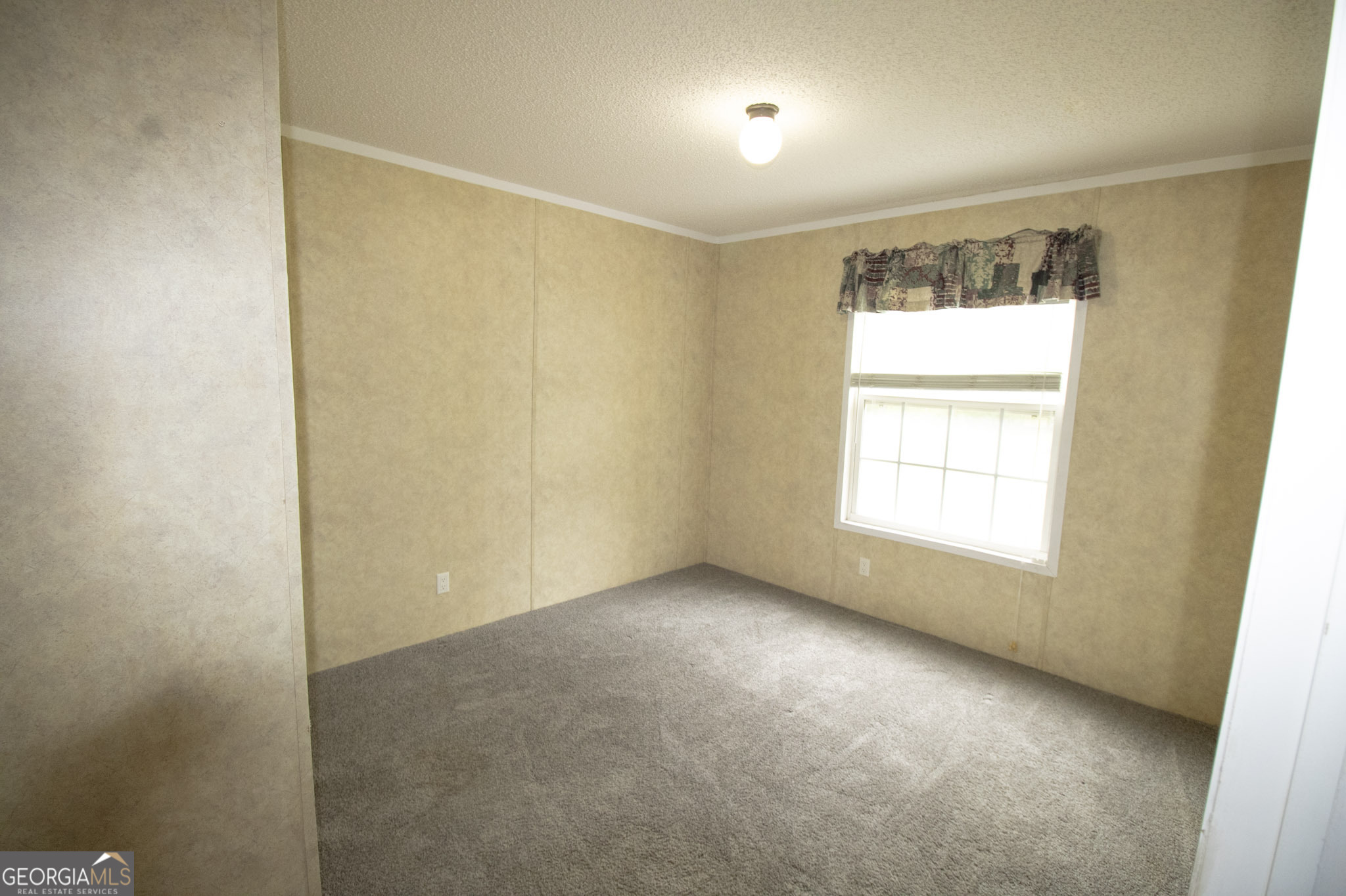 1776 Zettwell Road Statesboro, GA 30461 - Photo 14 of 20 an empty room with a window
