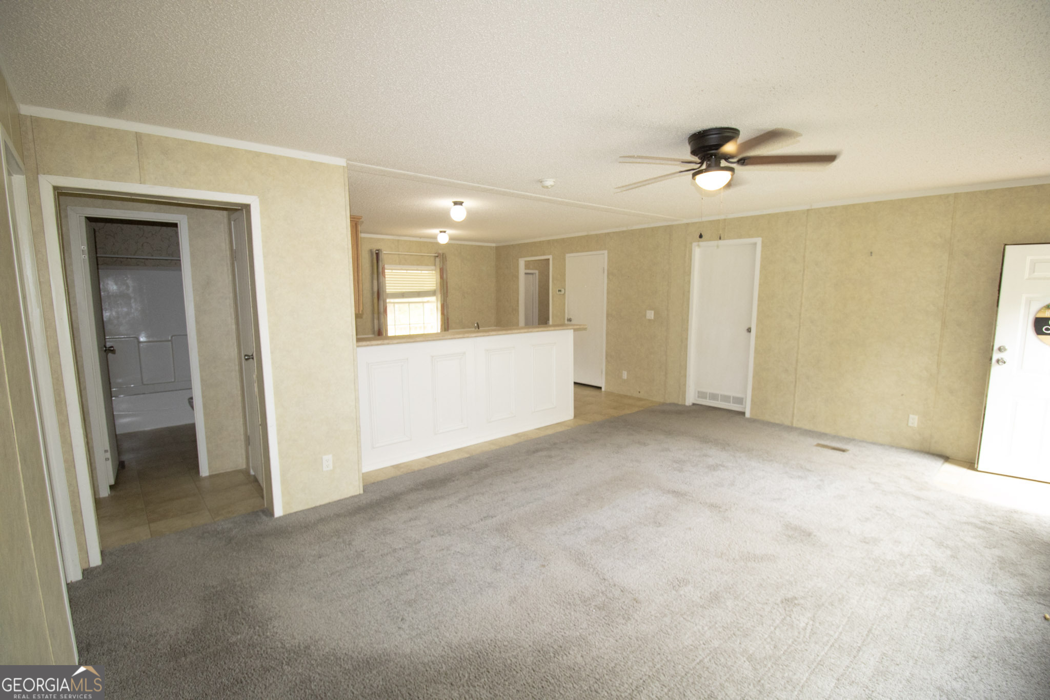 1776 Zettwell Road Statesboro, GA 30461 - Photo 4 of 20 a view of a big room with closet and windows