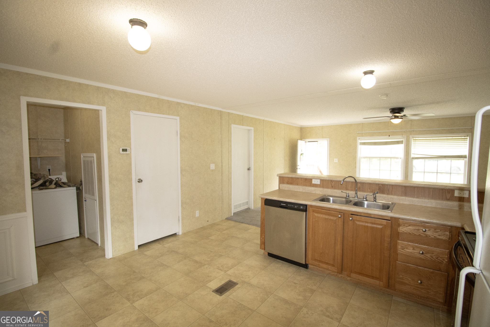 1776 Zettwell Road Statesboro, GA 30461 - Photo 6 of 20 a kitchen with a sink and cabinets