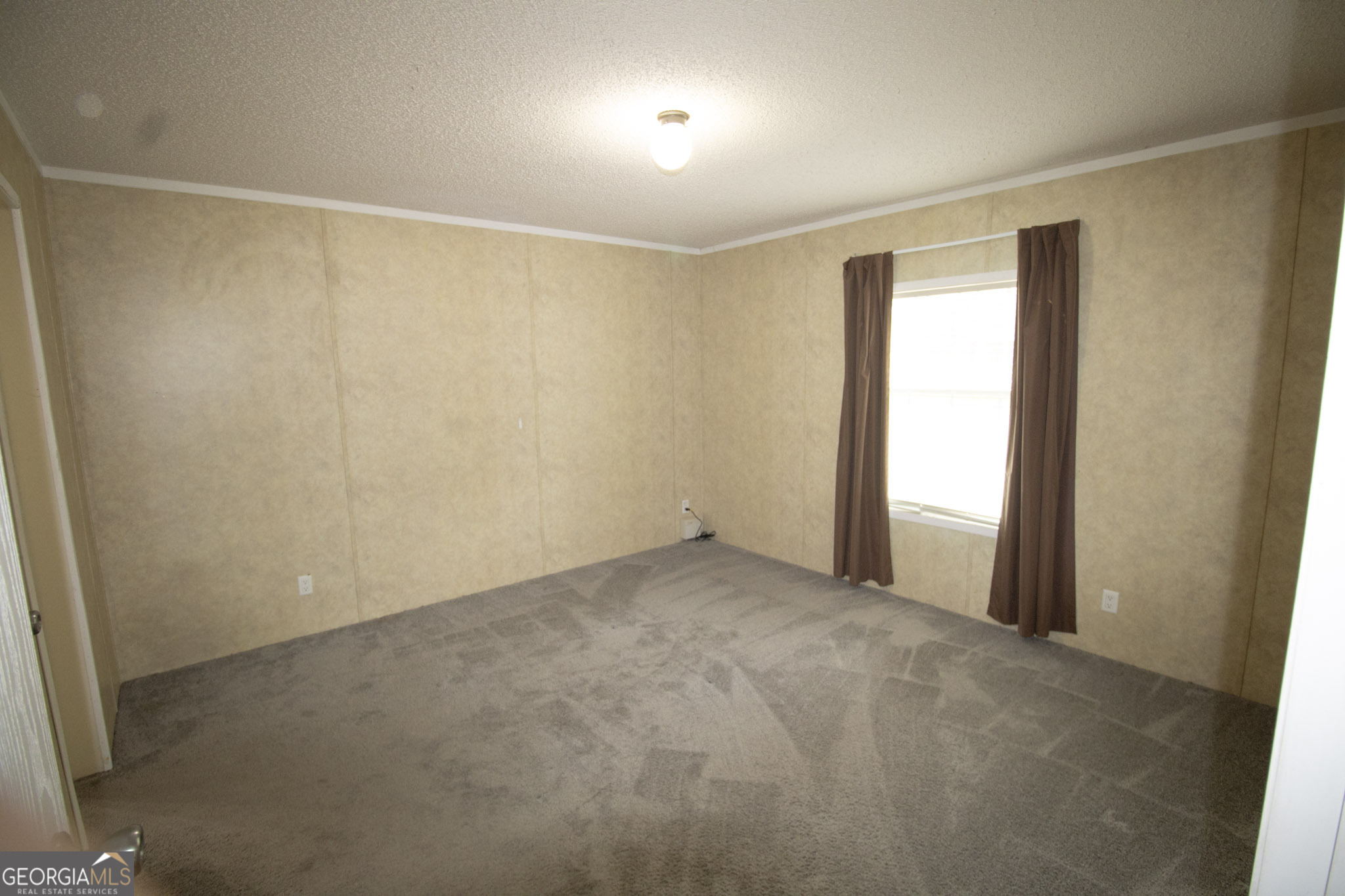 1776 Zettwell Road Statesboro, GA 30461 - Photo 8 of 20 an empty room with a empty space and windows