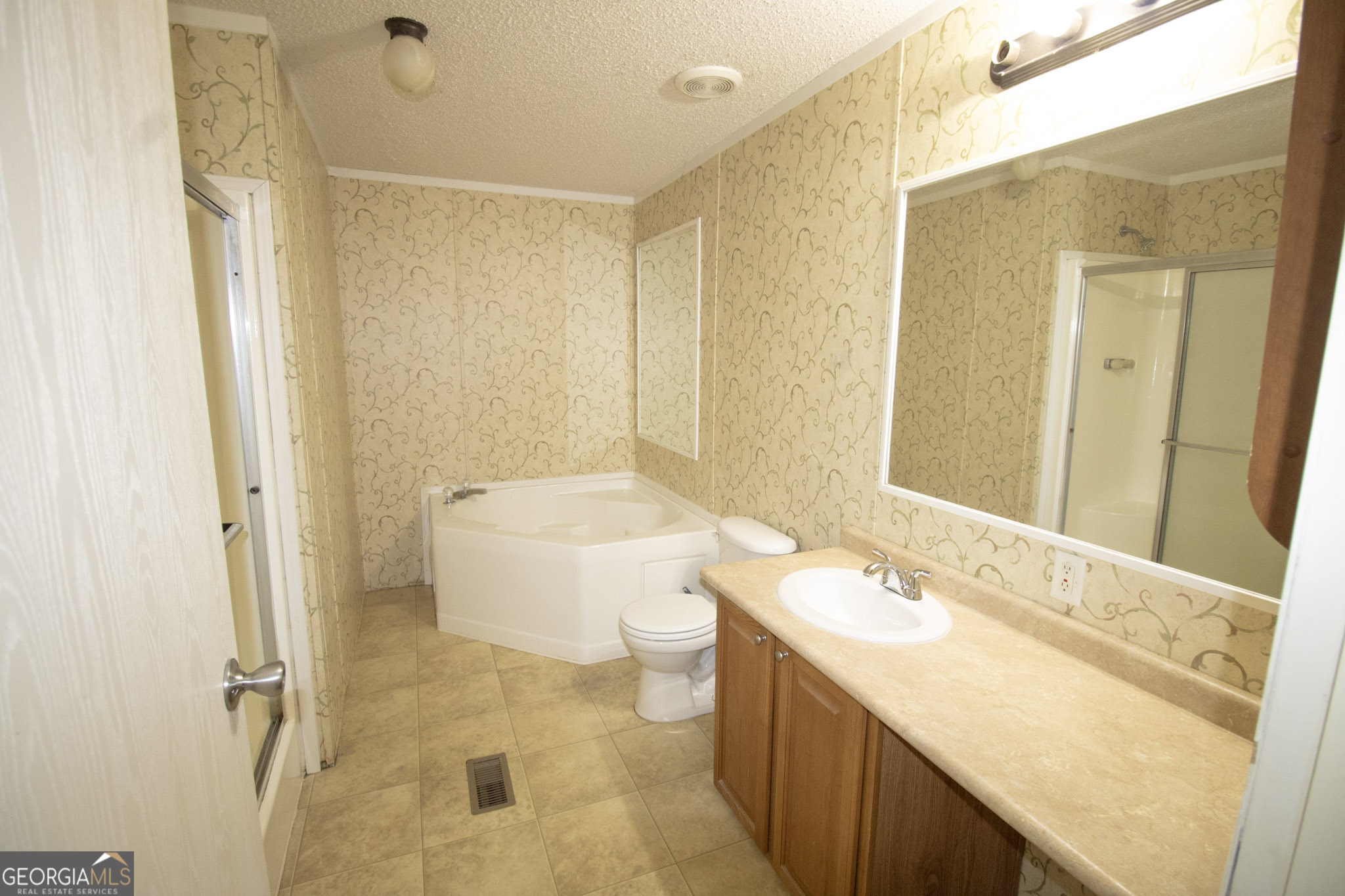 1776 Zettwell Road Statesboro, GA 30461 - Photo 10 of 20 a bathroom with a granite countertop sink toilet and shower