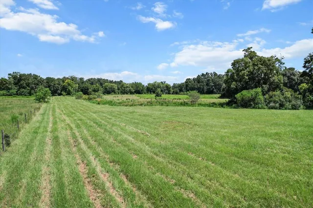 a kitchen with refrigerator and stove