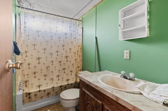 an aerial view of a city with lots of green space