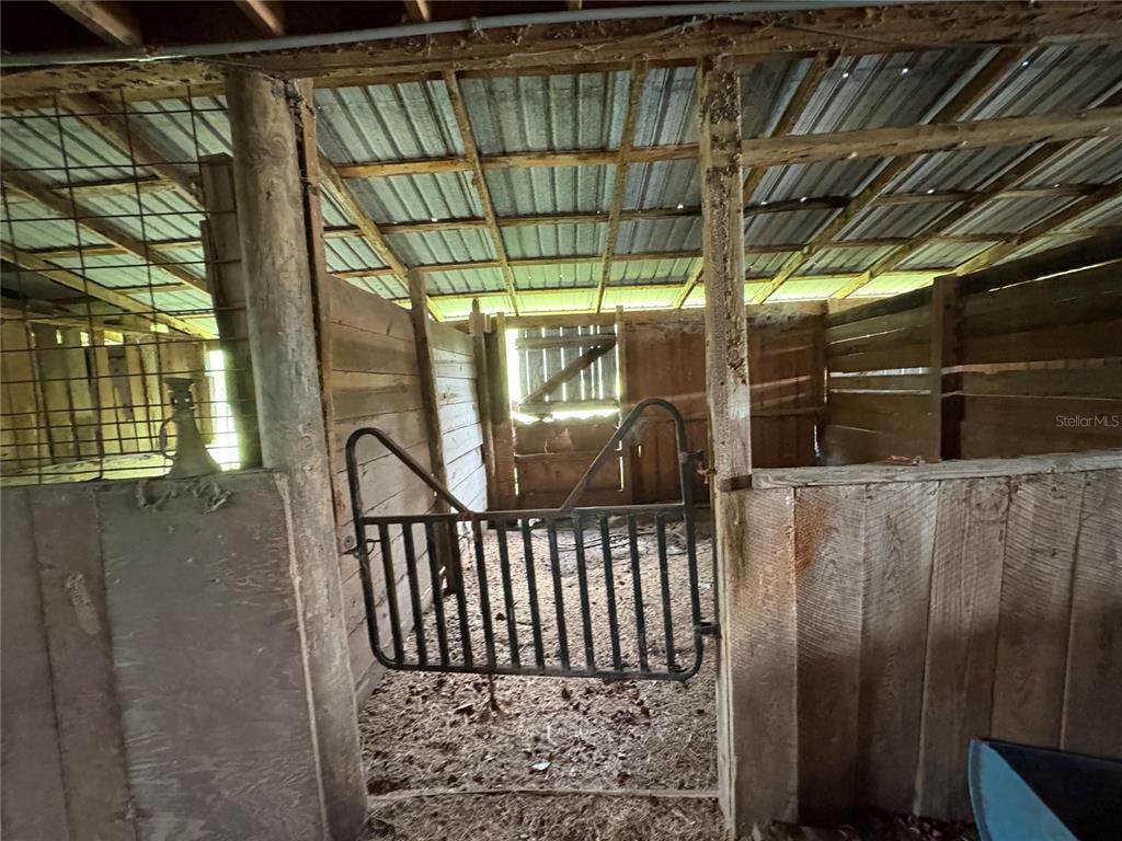 6177 County Road 625 Bushnell, FL 33513 - Photo 42 of 93 a view of a porch with a door and wooden floor
