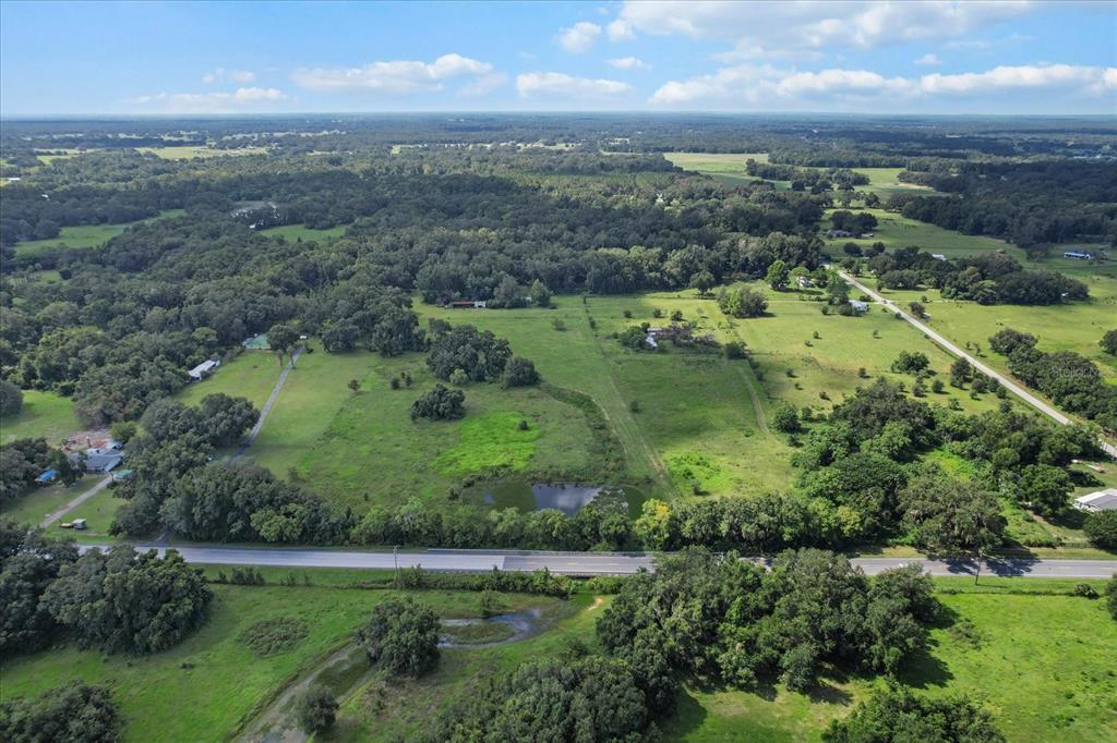 6177 County Road 625 Bushnell, FL 33513 - Photo 45 of 93 an aerial view of a city with lots of green space