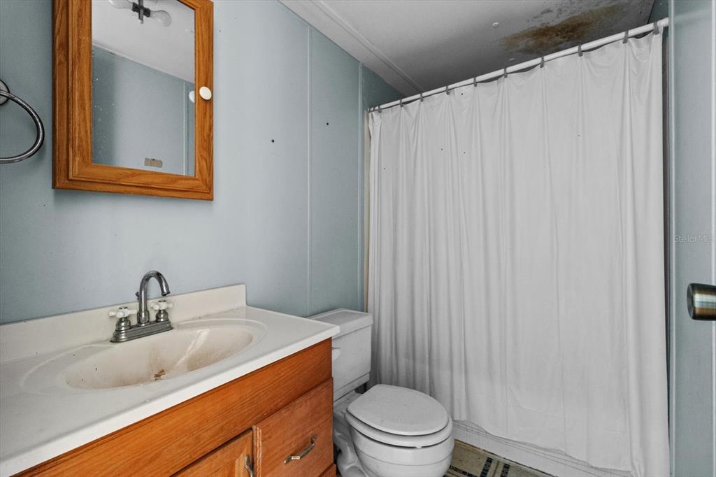 6177 County Road 625 Bushnell, FL 33513 - Photo 71 of 93 a bathroom with a toilet a sink and a mirror