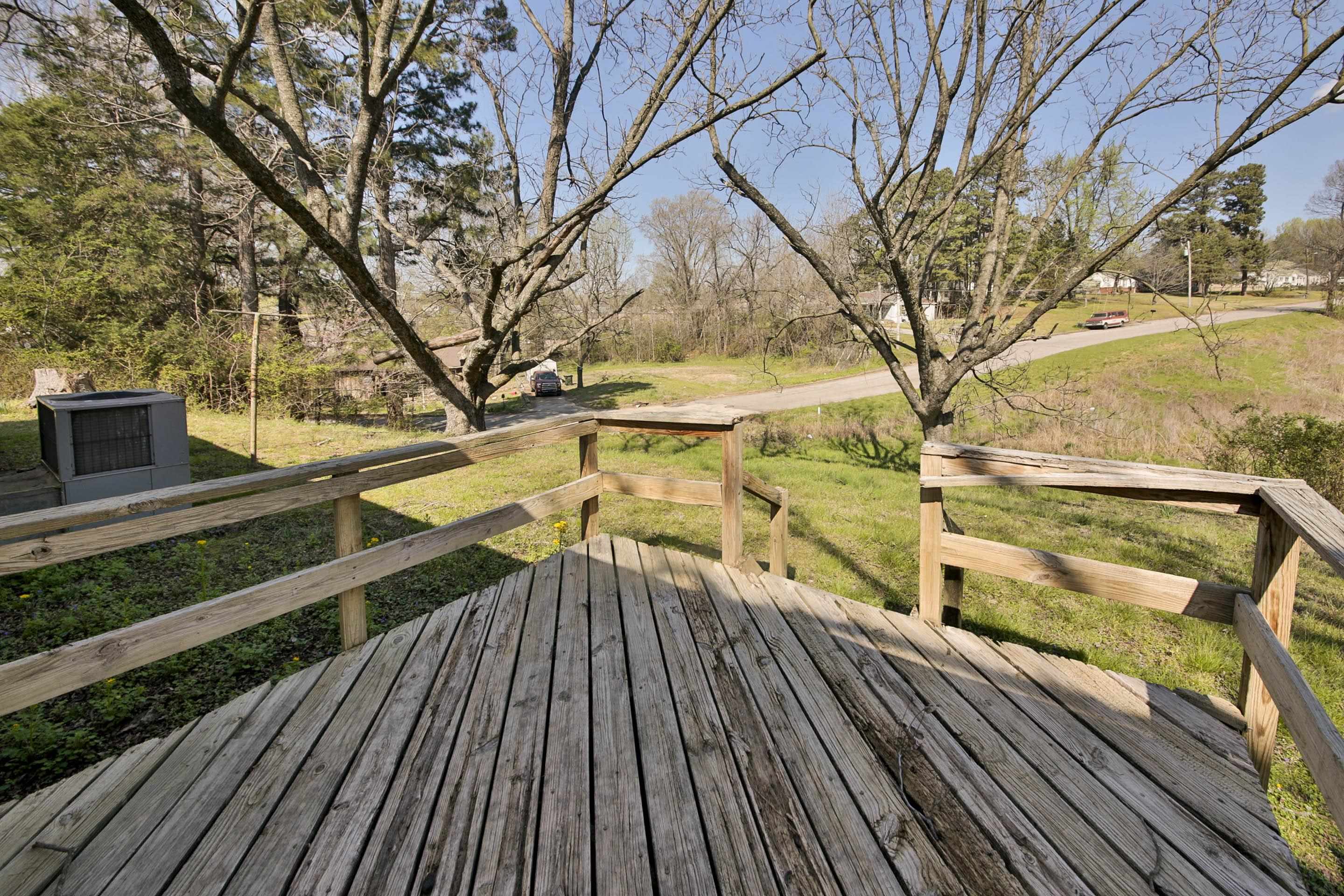 322 Highland Street Ripley, TN 38063 - Photo 5 of 12 a view of balcony with wooden floor and fence
