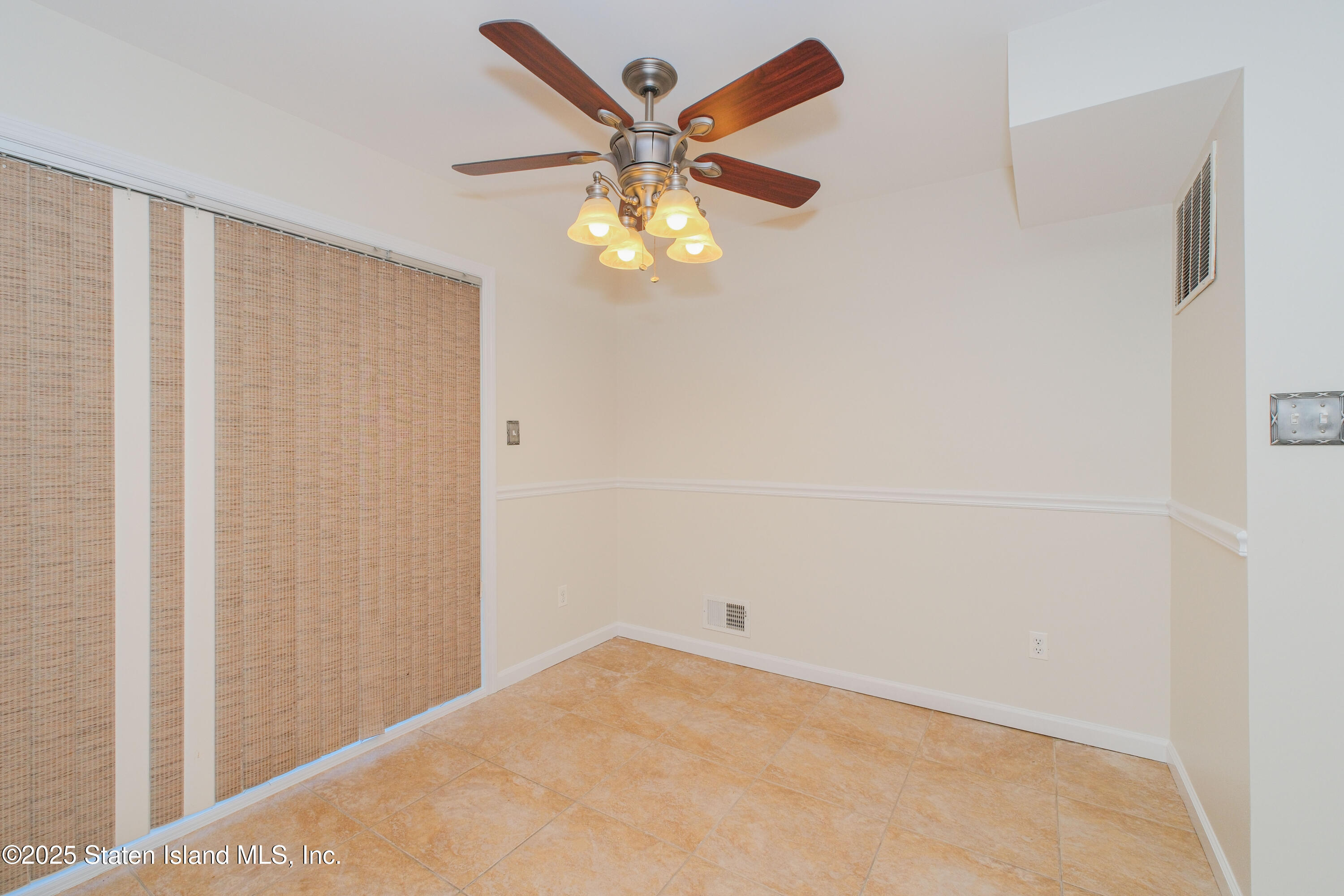 49 Endview Street Staten Island, NY 10312 - Photo 17 of 38 a view of an empty room with a window