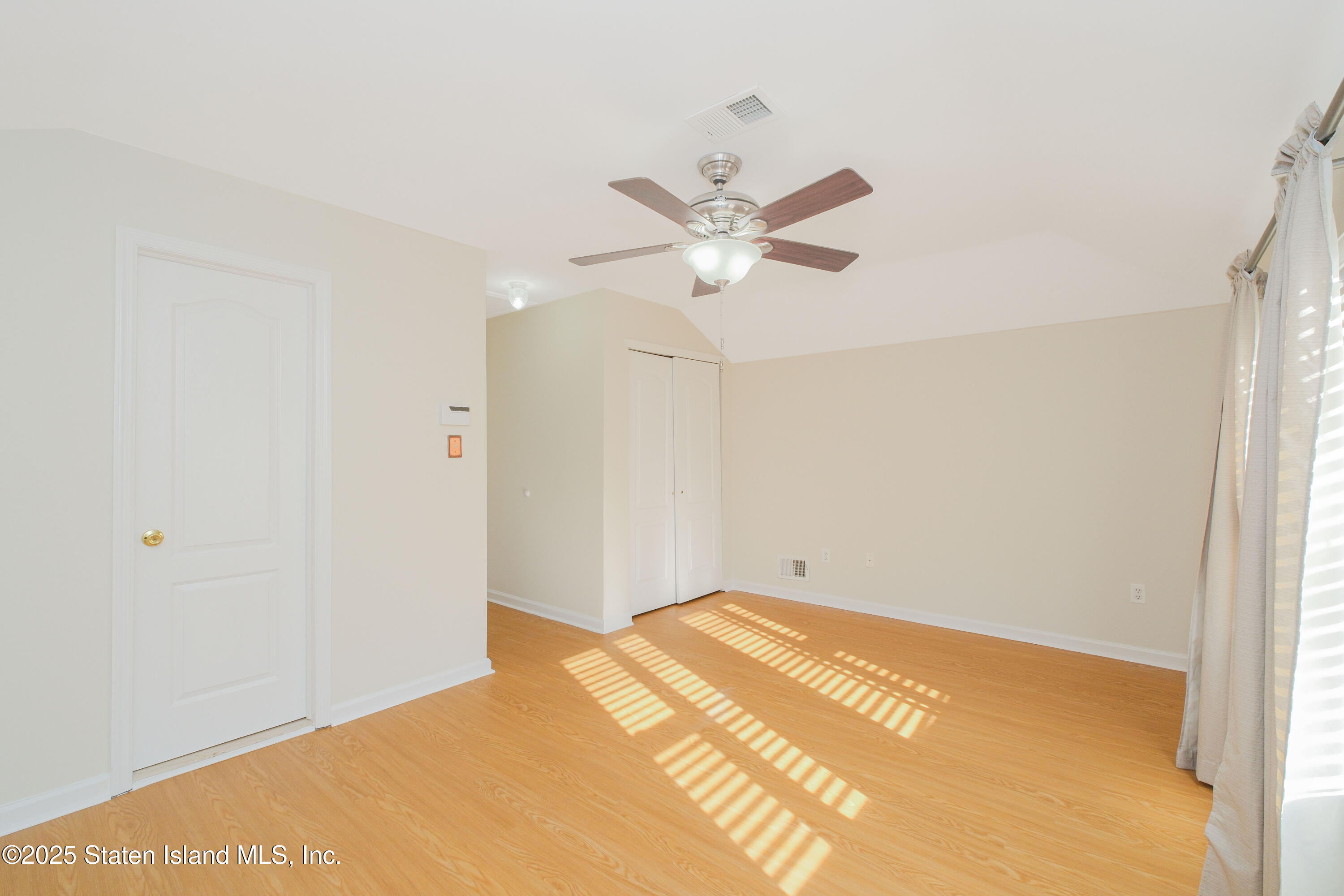 49 Endview Street Staten Island, NY 10312 - Photo 21 of 38 a view of a big room with closet and ceiling fan