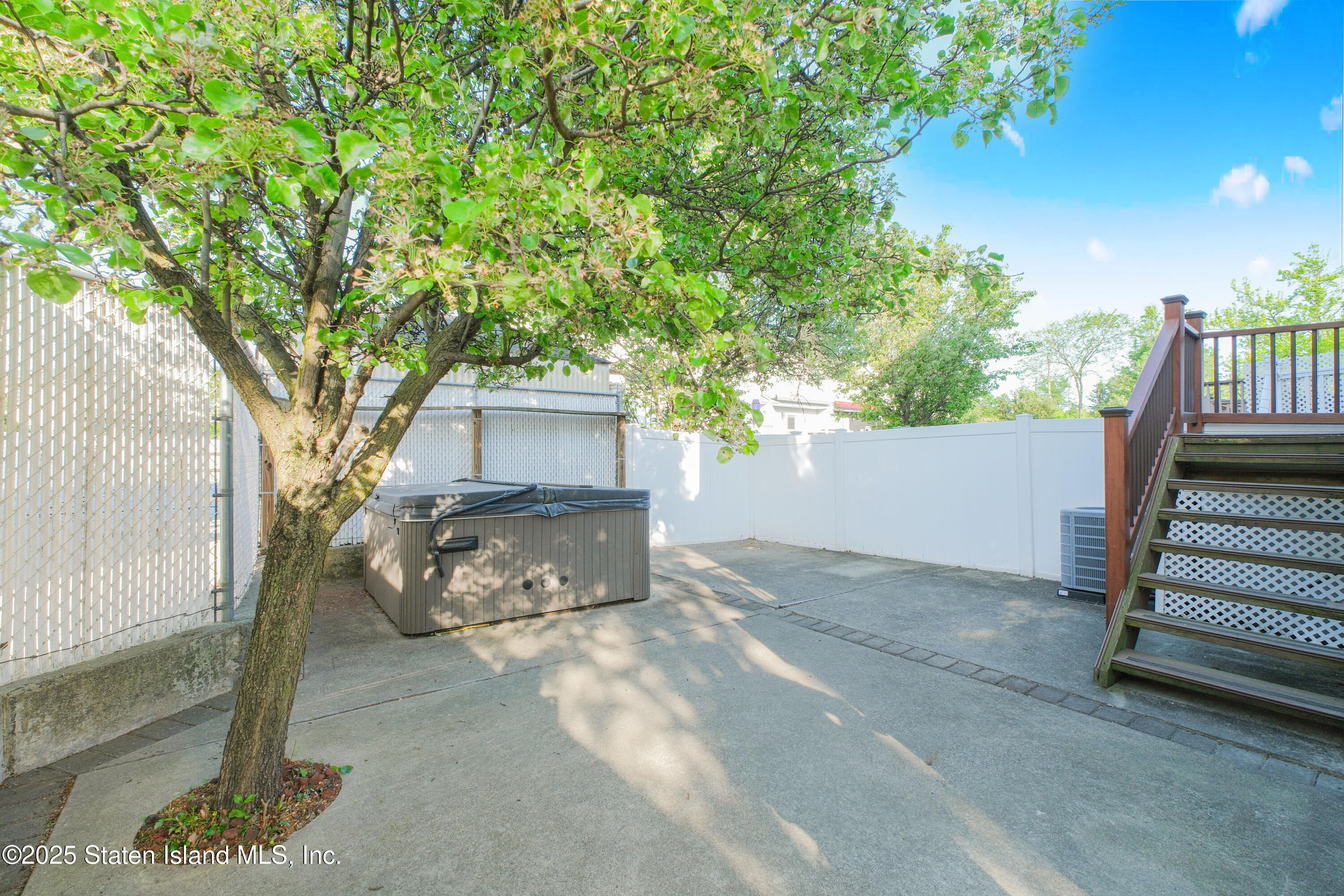 49 Endview Street Staten Island, NY 10312 - Photo 36 of 38 a view of a house with a tree in the background