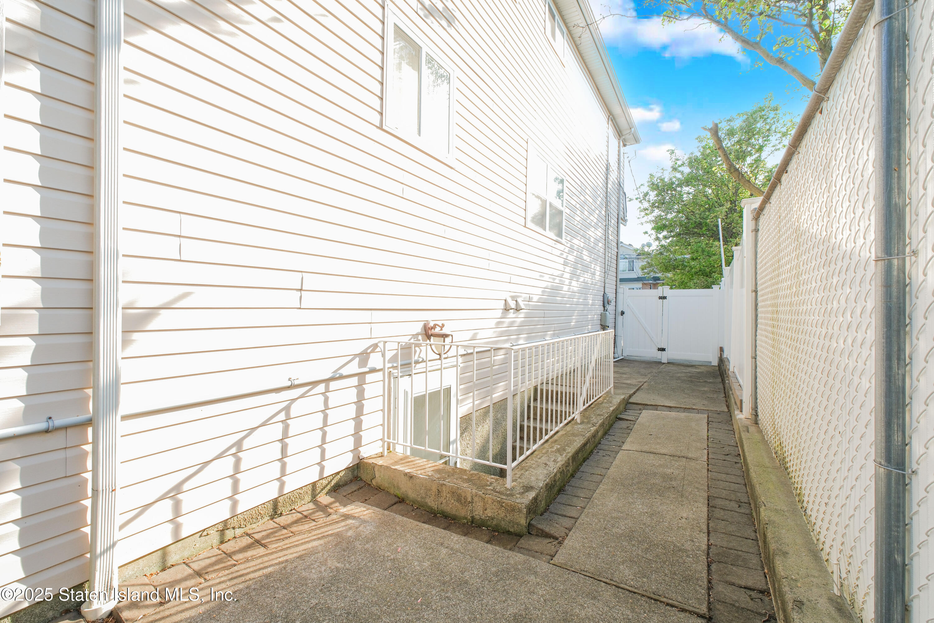 49 Endview Street Staten Island, NY 10312 - Photo 38 of 38 a view of a balcony with wooden floor and fence
