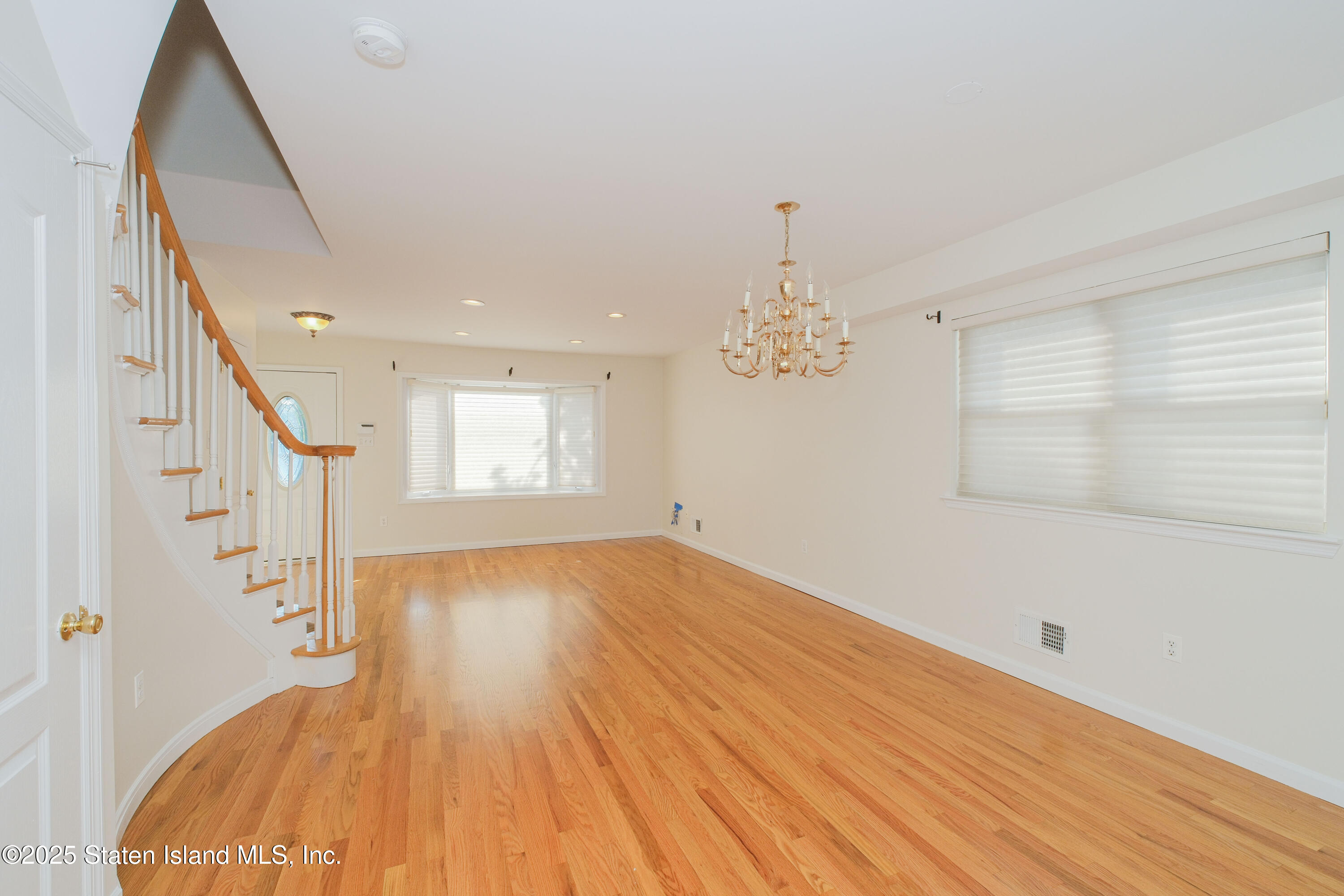 49 Endview Street Staten Island, NY 10312 - Photo 5 of 38 a view of empty room with wooden floor and fan