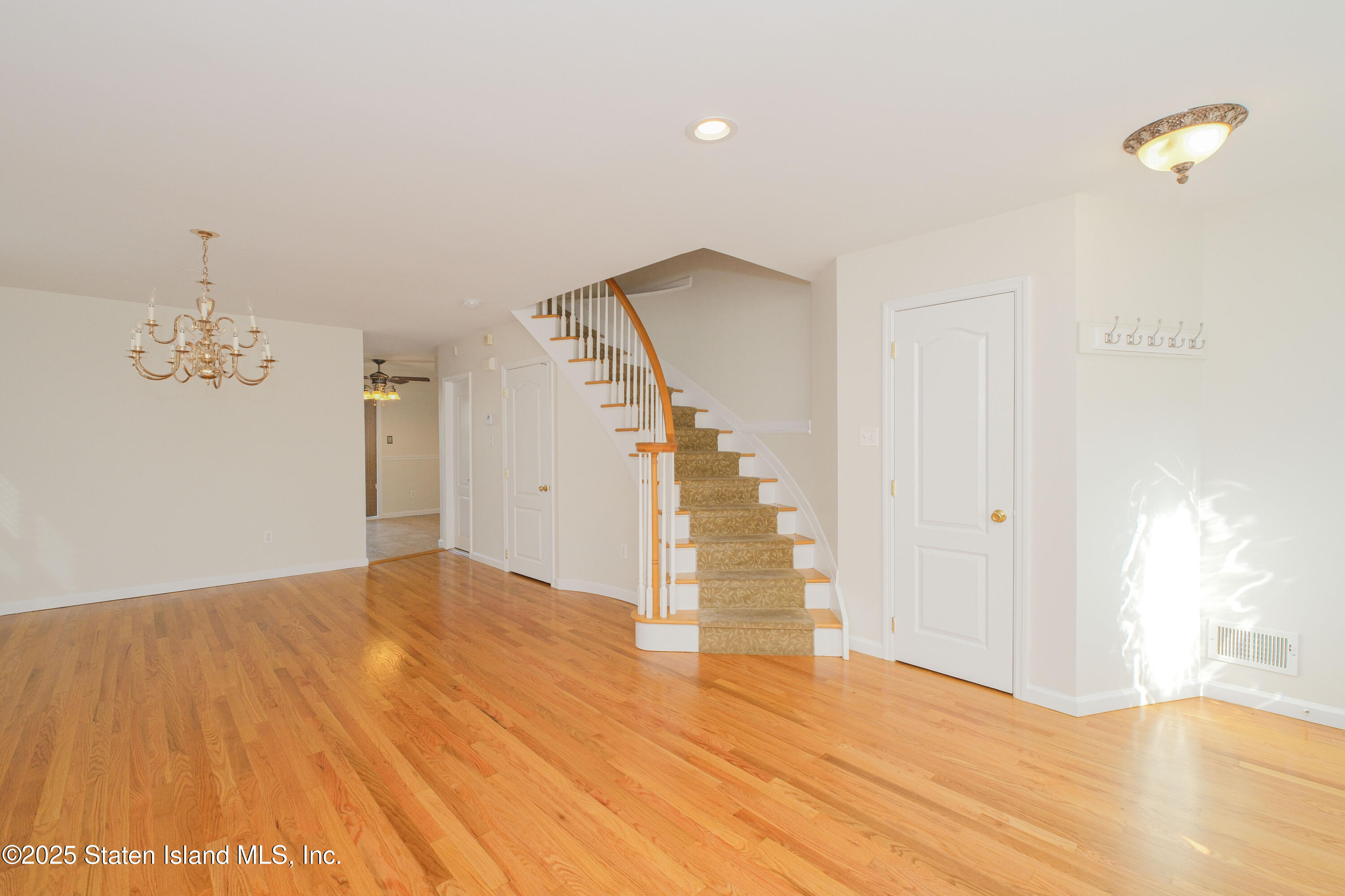 49 Endview Street Staten Island, NY 10312 - Photo 7 of 38 a view of empty room with wooden floor and fan