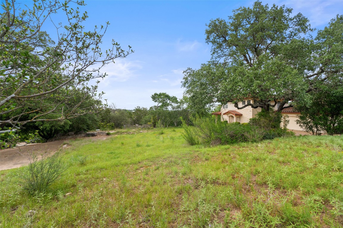711 Sunfish Street Lakeway, TX 78734 - Photo 18 of 23 a view of an outdoor space and a yard