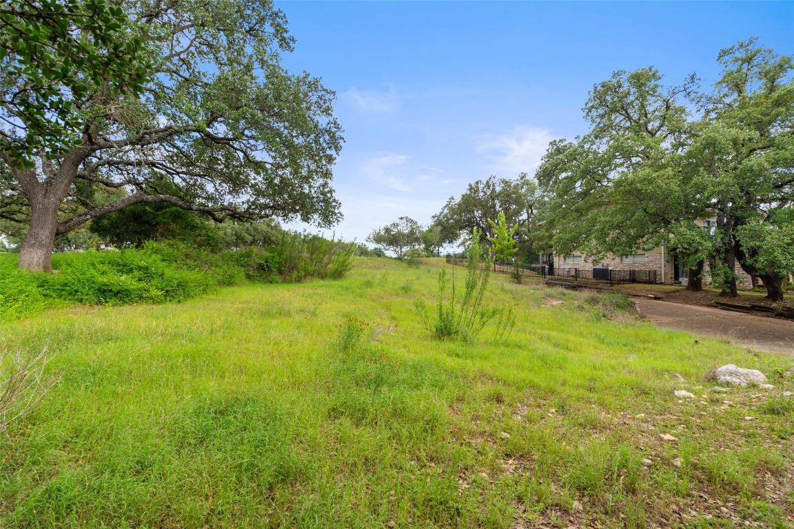 711 Sunfish Street Lakeway, TX 78734 - Photo 20 of 23 a view of swimming pool with a yard