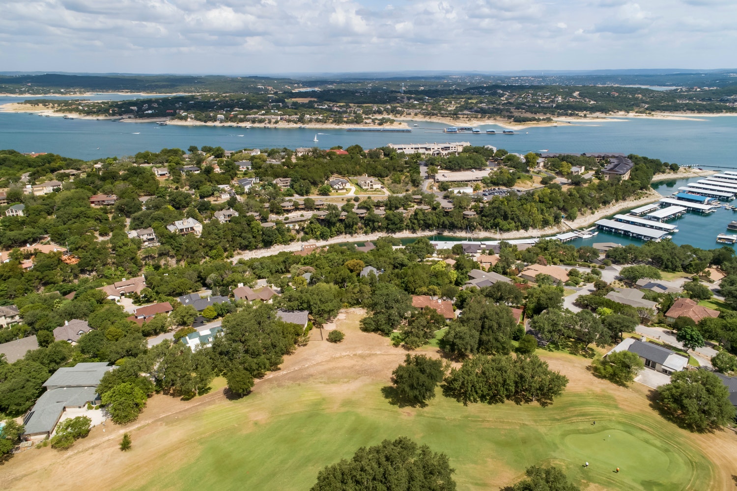 711 Sunfish Street Lakeway, TX 78734 - Photo 6 of 23 Aerial view of residential area featuring a large body of water and a Yaupon golf course