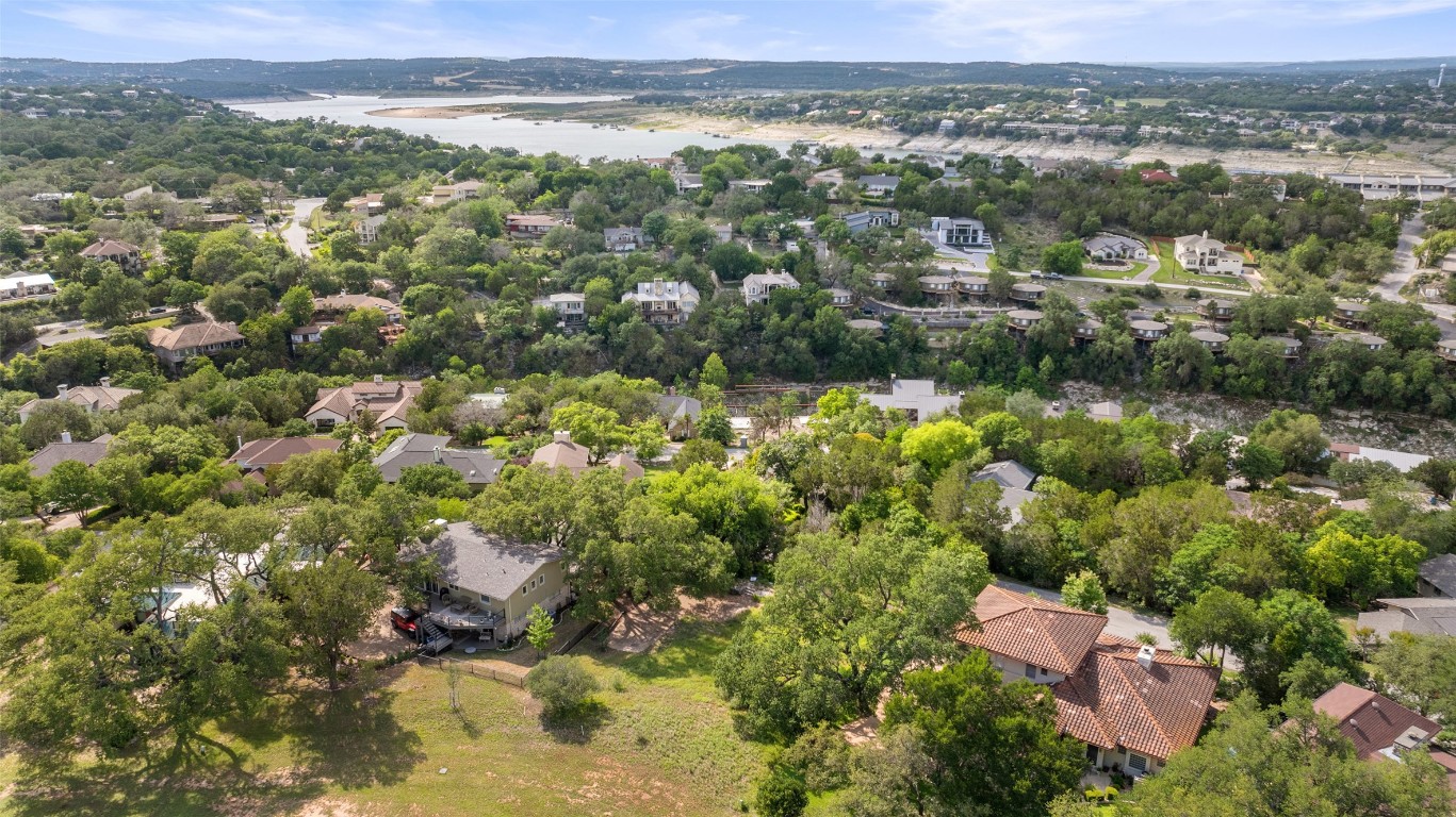 711 Sunfish Street Lakeway, TX 78734 - Photo 9 of 23 an aerial view of residential houses with outdoor space and trees
