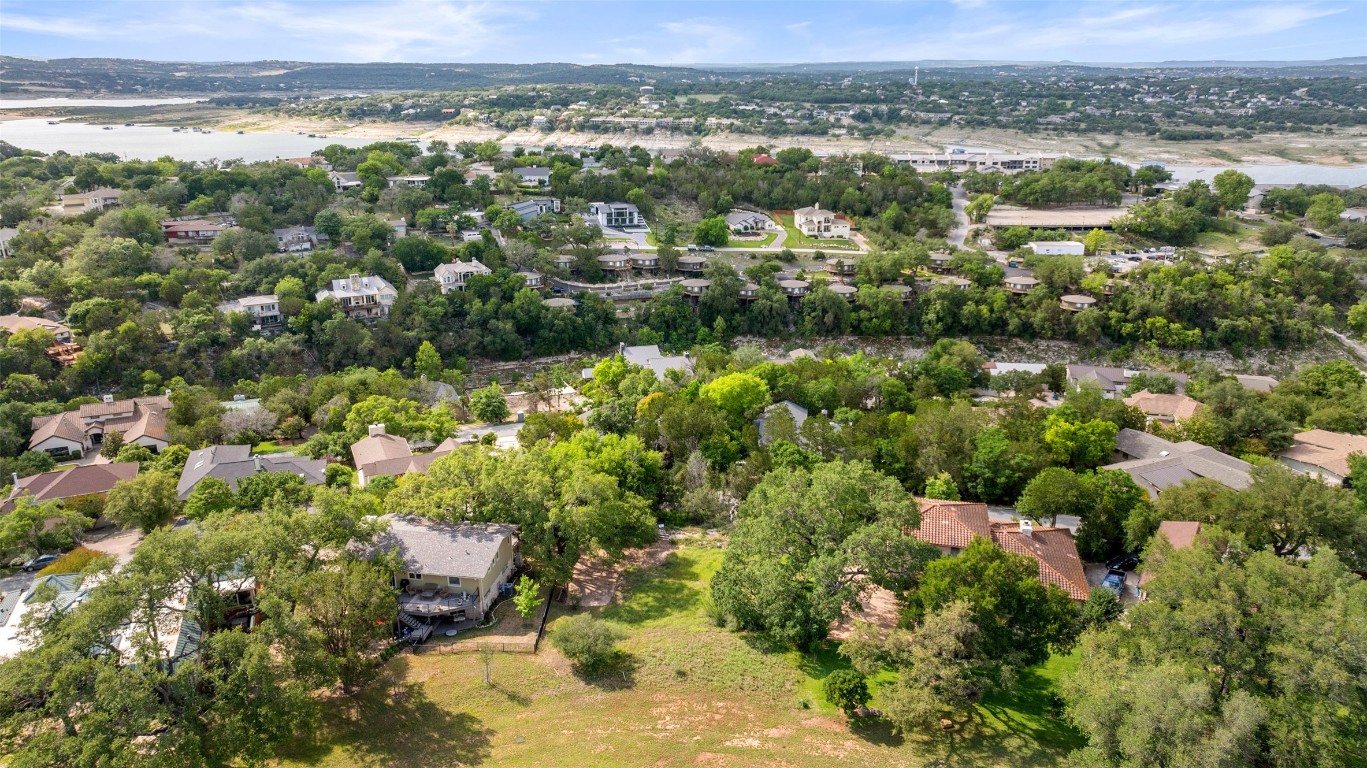 711 Sunfish Street Lakeway, TX 78734 - Photo 10 of 23 an aerial view of a houses with a yard and lake