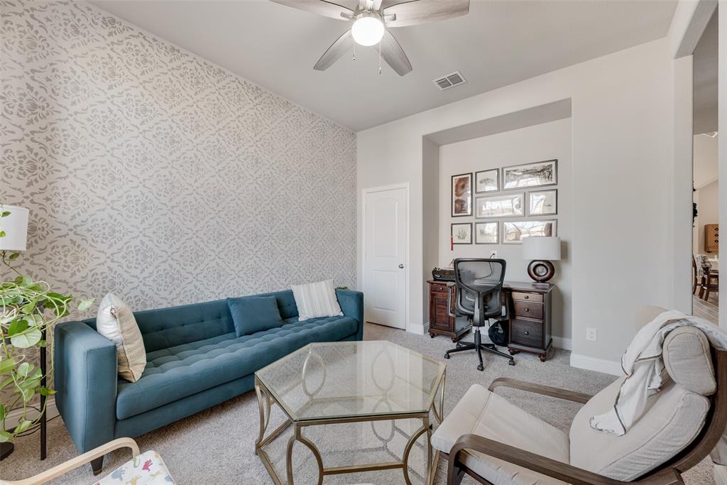 14809 Cedar Flt Way Fort Worth, TX 76262 - Photo 10 of 18 Living area featuring an accent wall, an office area, carpet, ceiling fan, and wallpapered walls