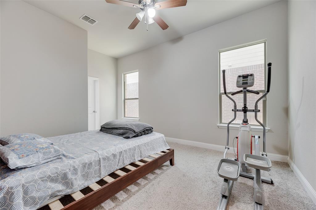 14809 Cedar Flt Way Fort Worth, TX 76262 - Photo 12 of 18 Bedroom with carpet flooring and ceiling fan