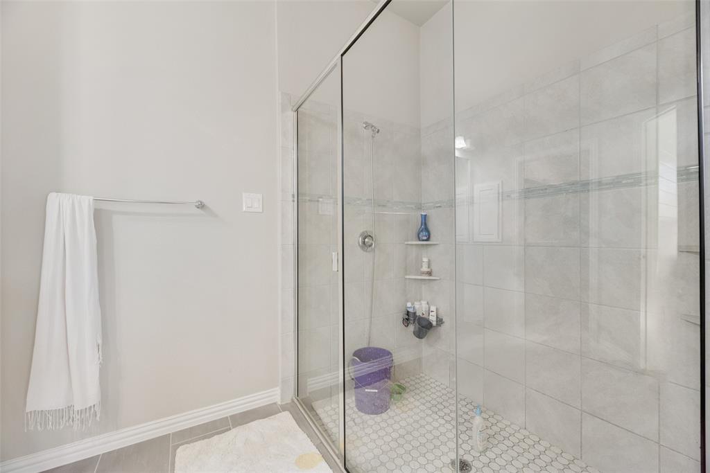 14809 Cedar Flt Way Fort Worth, TX 76262 - Photo 15 of 18 Bathroom featuring a shower stall and tile patterned flooring