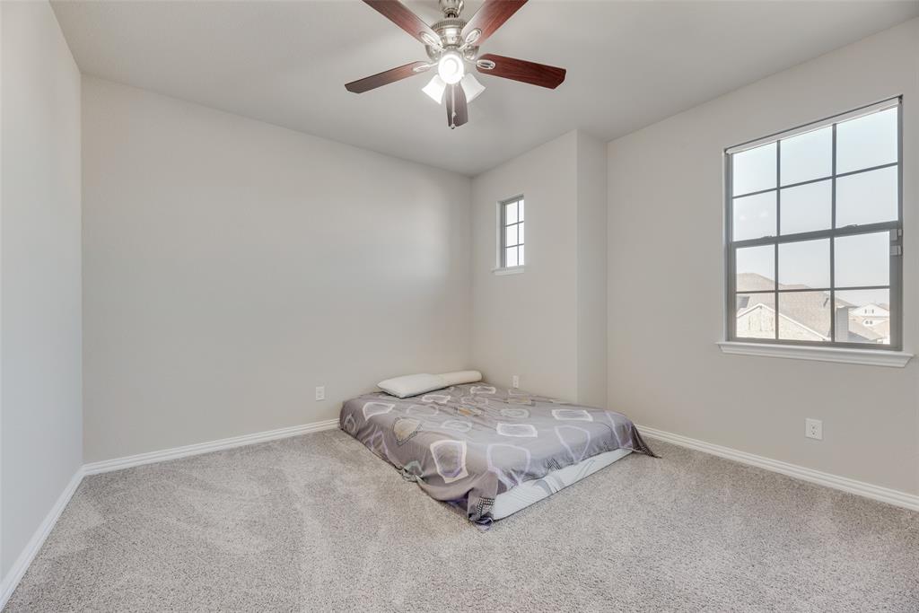 14809 Cedar Flt Way Fort Worth, TX 76262 - Photo 6 of 18 Bedroom featuring carpet flooring and a ceiling fan