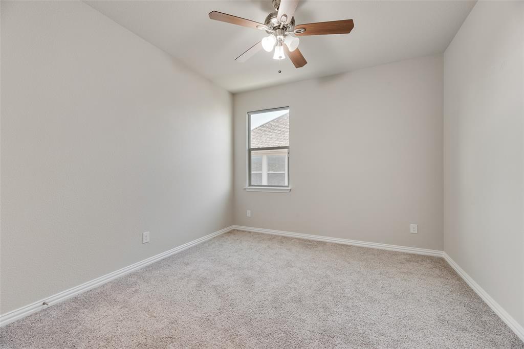 14809 Cedar Flt Way Fort Worth, TX 76262 - Photo 7 of 18 Spare room with light colored carpet and ceiling fan