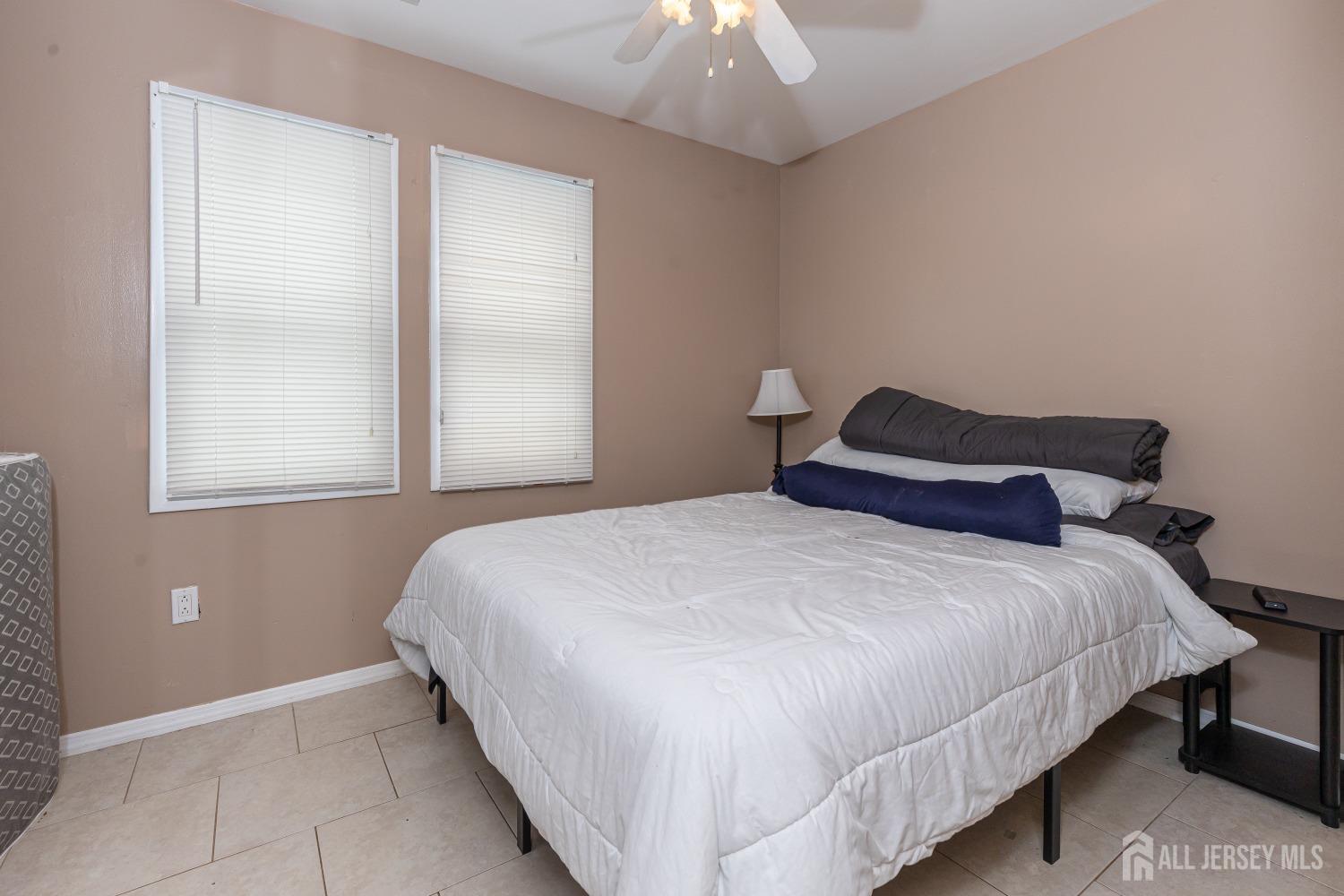 560 Lloyd Road Toms River, NJ 08753 - Photo 13 of 18 a bedroom with a bed and a window