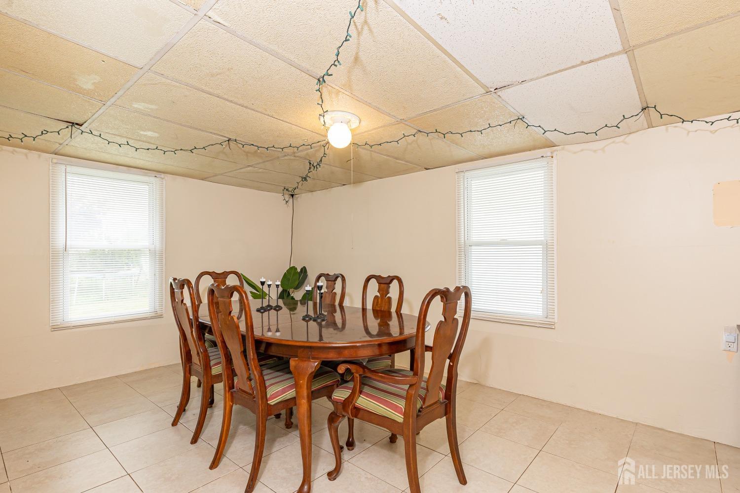 560 Lloyd Road Toms River, NJ 08753 - Photo 15 of 18 a view of a dining room with furniture and window