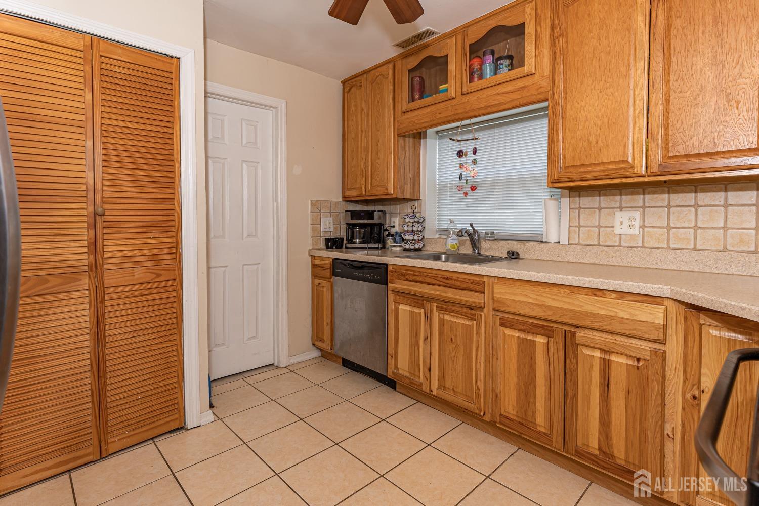 560 Lloyd Road Toms River, NJ 08753 - Photo 6 of 18 a kitchen with stainless steel appliances granite countertop a sink and a cabinets